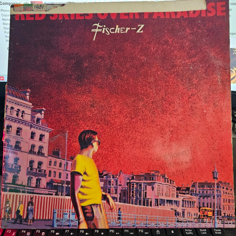 Fischer-Z - Red Skies Over Paradise (LP) Vinyl LP Media VG+ / Sleeve Zie Foto "VINYLSINGLES.NL"