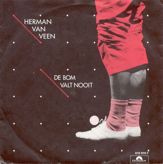 Herman van Veen - De Bom Valt Nooit Vinyl Singles Vinyl Zeer Goed / Hoesje Goed "VINYLSINGLES.NL"