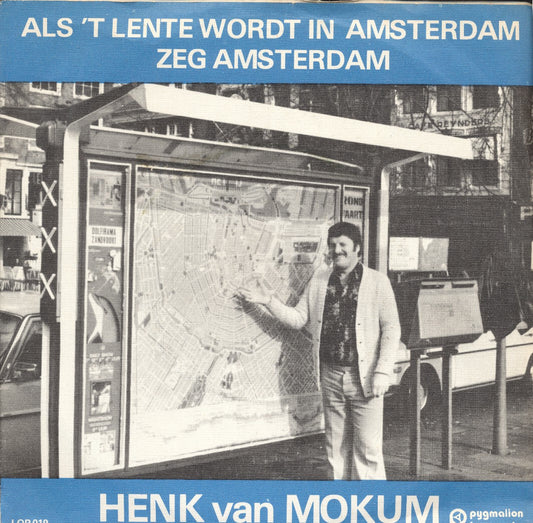 Henk van Mokum - Als 't Het Lente Wordt In Amsterdam Vinyl Singles Vinyl Zeer Goed / Hoesje Goed "VINYLSINGLES.NL"