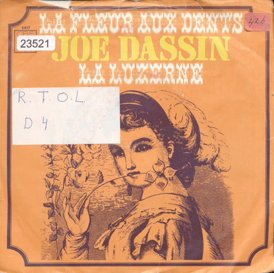 Joe Dassin - La Fleur Aux Dents 23621 (B) Vinyl Singles Vinyl Goed / Hoes Sticker