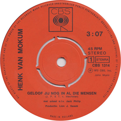 Henk Van Mokum - Geloof Jij Nog In Al Die Mensen Vinyl Singles Vinyl Zeer Goed / Hoesje Goed "VINYLSINGLES.NL"