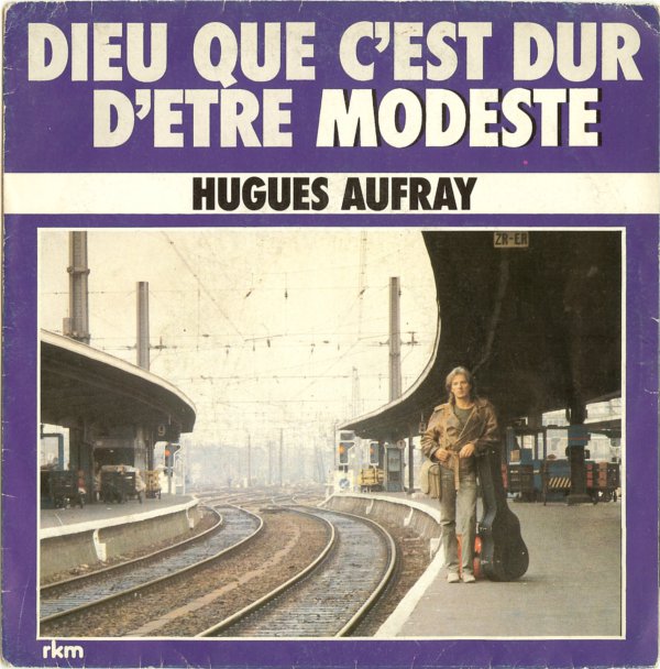 Hugues Aufray - Dieu Que C’est Dur D’être Modeste Vinyl Singles Vinyl Zeer Goed / Hoesje Goed "VINYLSINGLES.NL"