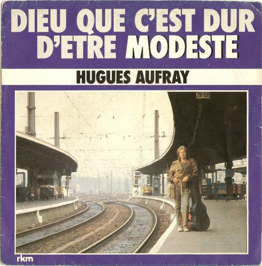 Hugues Aufray - Dieu Que C’est Dur D’être Modeste Vinyl Singles Vinyl Zeer Goed / Hoesje Goed "VINYLSINGLES.NL"