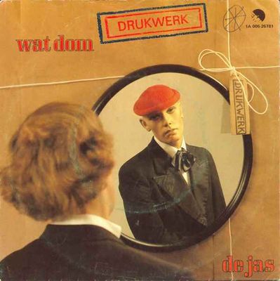 Drukwerk - Wat Dom Vinyl Singles Vinyl Zeer Goed / Hoesje Goed "VINYLSINGLES.NL"